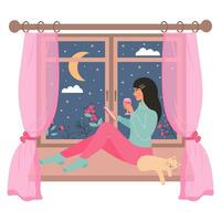 Young woman sitting on the window with a glass of wine and using smartphone. Cute cat sleeping near her. Snowy night weather outside the window. vector