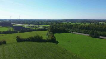 Aerial view on the A7 motorway in northern Germany between fields and meadows. video