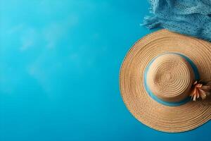 Summer background with sunhat, seashells and starfish on blue background. photo