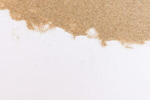 Sand on white background photo