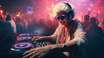 Bright elderly woman DJ at a rave. Techno party in the club. Grandma DJ. photo