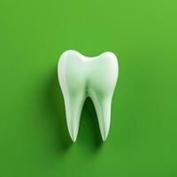 White tooth on a green background. photo