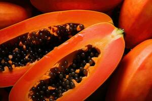 Papaya, halves of fresh juicy orange tropical fruit. photo