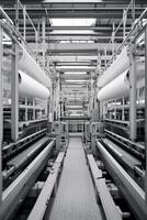 Modern textile factory with automated looms weaving patterns photo