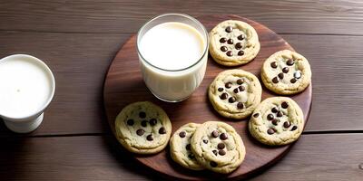 Soy milk and tasty cookies on a wooden table. photo