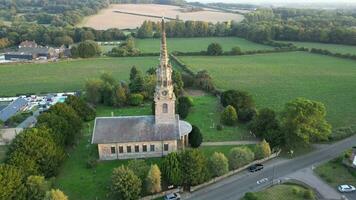 Church in village with tower bell and clock video