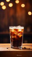 Refreshing Cold Brew Coffee in Clear Glass on a Vintage Wooden Table with Copy Space photo
