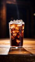 Refreshing Cold Brew Coffee in Clear Glass on a Vintage Wooden Table with Copy Space photo