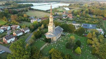 Church in village with tower bell and clock video