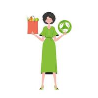 The girl is depicted in full growth and holds a bag of healthy food in her hands and shows the EKO icon. Isolated on white background. Trend style, vector illustration.