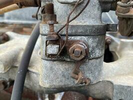 old and rusty valve on the background of old rusty pipe photo