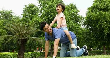 Cheerful african american father giving son piggyback ride outdoors  smiling, Happiness family concepts 6774671 Stock Photo at Vecteezy