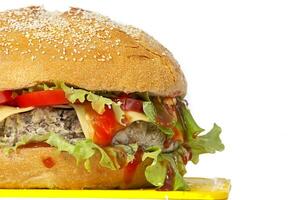 Portion of fresh tasty burger isolated on white background. Half hamburger food. photo