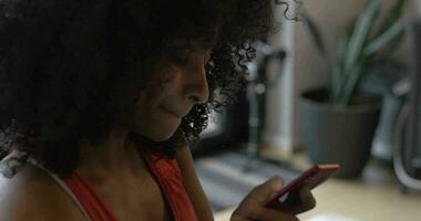 Beautiful Black Woman Looks at Social Media in Home video