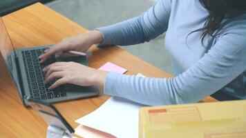 Asian female business woman writing down customer's orders video