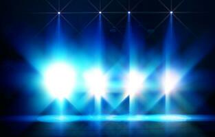 Bright blue rays of light from stage spotlights on a dark background. photo