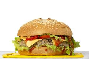Big hamburger on a white background with copy space.Burger. photo
