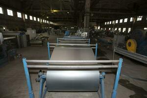 Metal stainless ventilation pipes at a metallurgical plant. Rolled metal. photo