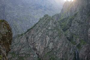 Rocky texture of highlands. Dark rocks. photo