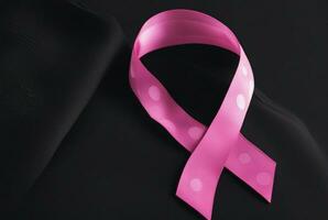 Breast cancer pink ribbon on black cushion image generate by ai. photo