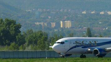 ALMATY, KAZAKHSTAN MAY 5, 2019 - SCAT Airlines Boeing 737 UP B3710 accelerate before departure against Almaty city skyline. Almaty International Airport, Kazakhstan video