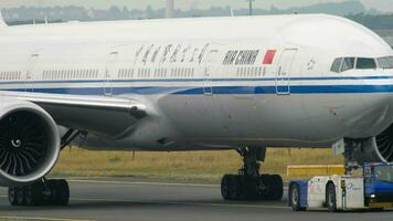 FRANKFURT AM MAIN, GERMANY JULY 17, 2017 - Air China Boeing 777 B 7952 towing by tractor from service. Fraport, Frankfurt, Germany video