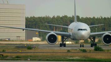 FRANKFURT AM MAIN, GERMANY JULY 18, 2017 - Boeing 777 FedEx Cargo N883FD flight FX3 from Munich MUC, taxiing after landing. Fraport, Frankfurt, Germany video