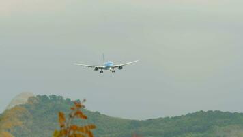 PHUKET, THAILAND FEBRUARY 19, 2023 - Boeing 787 Dreamliner of Etihad Airways with Manchester City Livery approoaching before landing at Phuket Airport. Aircraft arriving, side view video