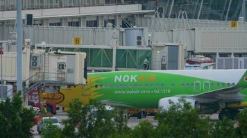 PHUKET, THAILAND NOVEMBER 26, 2019 - NOK Air Boeing 737 HS DBR taxiing ends, Phuket International airport video