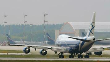 MOSCOW, RUSSIAN FEDERATION JULY 29, 2021 - Boeing 747 of AirBridgeCargo departure, take off at Sheremetyevo International Airport SVO. Huge airplane jumbo jet in flight, slow motion video