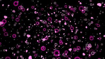 Particle heart and bubble floating to the top on the black screen video