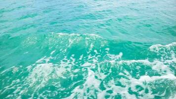 Waves and bubbles on the seawater are caused by the movement of ships video