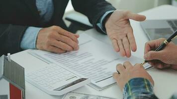 Real estate agent and customer signing contract to buy house, insurance or loan real estate.rent a house,get insurance or loan real estate or property. video