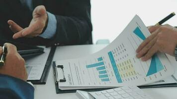 Team of business people working together in the meeting room office, teamwork background charts and graphs banner, double exposure successful teamwork,business planning concept. video