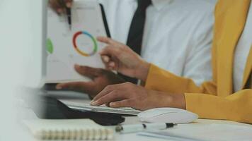 Financial Business team present. Business man hands hold documents with financial statistic stock photo, discussion, and analysis report data the charts and graphs. Finance Financial concept video