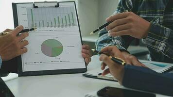 Team of business people working together in the meeting room office, teamwork background charts and graphs banner, double exposure successful teamwork,business planning concept. video