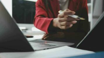 Financial Business team present. Business man hands hold documents with financial statistic stock photo, discussion, and analysis report data the charts and graphs. Finance Financial concept video
