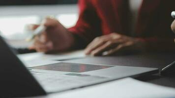 Financial Business team present. Business man hands hold documents with financial statistic stock photo, discussion, and analysis report data the charts and graphs. Finance Financial concept video