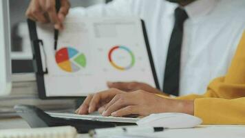 Financial Business team present. Business man hands hold documents with financial statistic stock photo, discussion, and analysis report data the charts and graphs. Finance Financial concept video