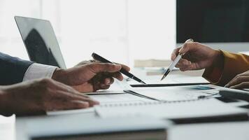 Financial Business team present. Business man hands hold documents with financial statistic stock photo, discussion, and analysis report data the charts and graphs. Finance Financial concept video
