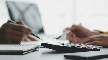 Financial Business team present. Business man hands hold documents with financial statistic stock photo, discussion, and analysis report data the charts and graphs. Finance Financial concept video
