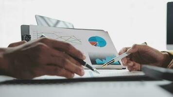 Financial Business team present. Business man hands hold documents with financial statistic stock photo, discussion, and analysis report data the charts and graphs. Finance Financial concept video