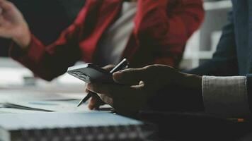 Financial Business team present. Business man hands hold documents with financial statistic stock photo, discussion, and analysis report data the charts and graphs. Finance Financial concept video