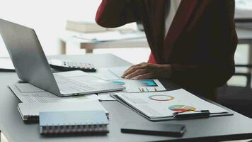 Financial Business team present. Business man hands hold documents with financial statistic stock photo, discussion, and analysis report data the charts and graphs. Finance Financial concept video