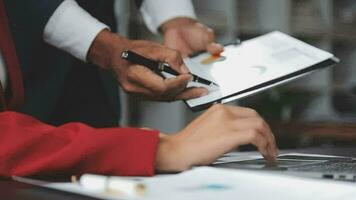 Financial Business team present. Business man hands hold documents with financial statistic stock photo, discussion, and analysis report data the charts and graphs. Finance Financial concept video