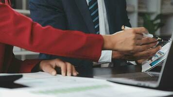 Financial Business team present. Business man hands hold documents with financial statistic stock photo, discussion, and analysis report data the charts and graphs. Finance Financial concept video