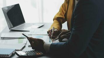 Financial Business team present. Business man hands hold documents with financial statistic stock photo, discussion, and analysis report data the charts and graphs. Finance Financial concept video
