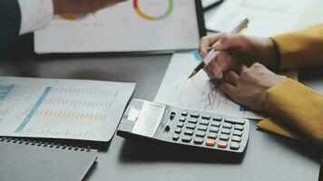 Financial Business team present. Business man hands hold documents with financial statistic stock photo, discussion, and analysis report data the charts and graphs. Finance Financial concept video