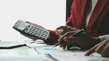 Financial Business team present. Business man hands hold documents with financial statistic stock photo, discussion, and analysis report data the charts and graphs. Finance Financial concept video