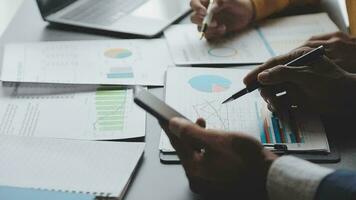 Financial Business team present. Business man hands hold documents with financial statistic stock photo, discussion, and analysis report data the charts and graphs. Finance Financial concept video